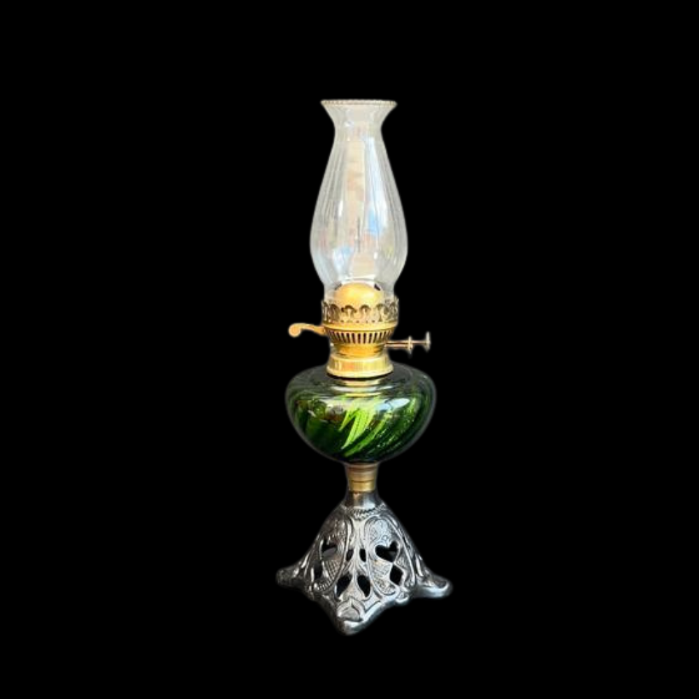 A black patinated cast brass patterned oil lamp base, with green swirl